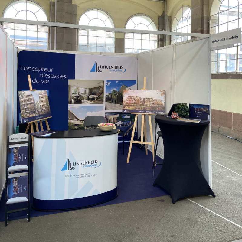 Conception graphique d’un stand complet pour un salon immobilier