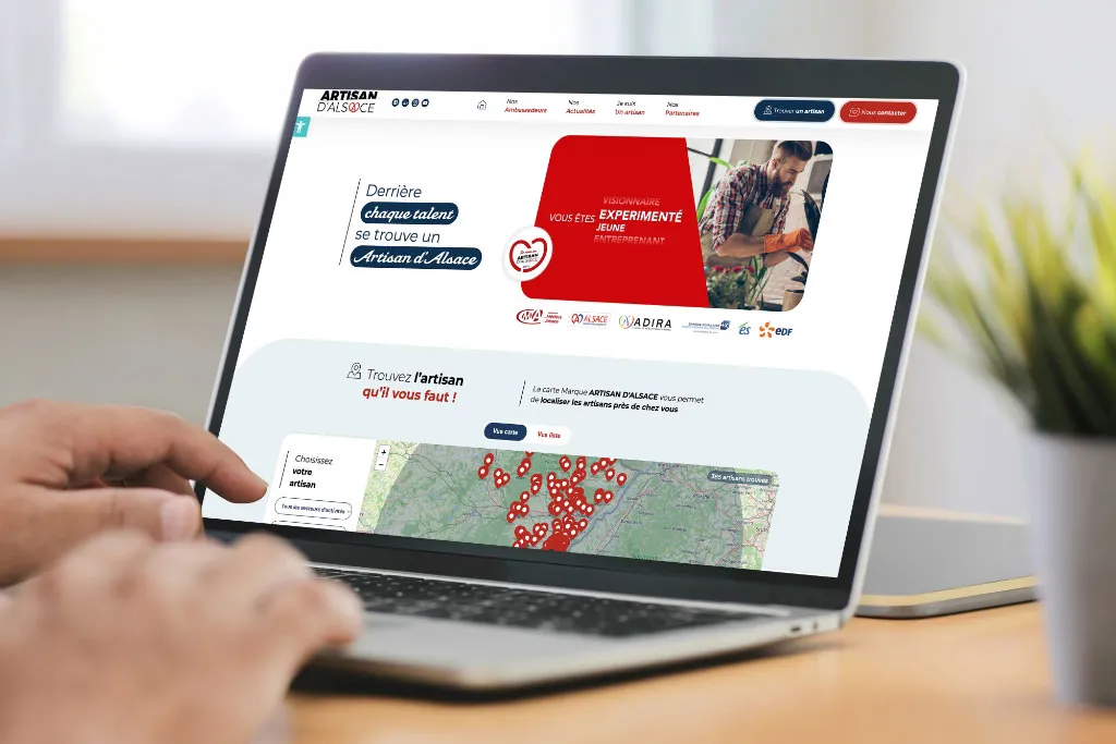 Interface du site Artisan d’Alsace mettant en avant les artisans locaux et la navigation intuitive